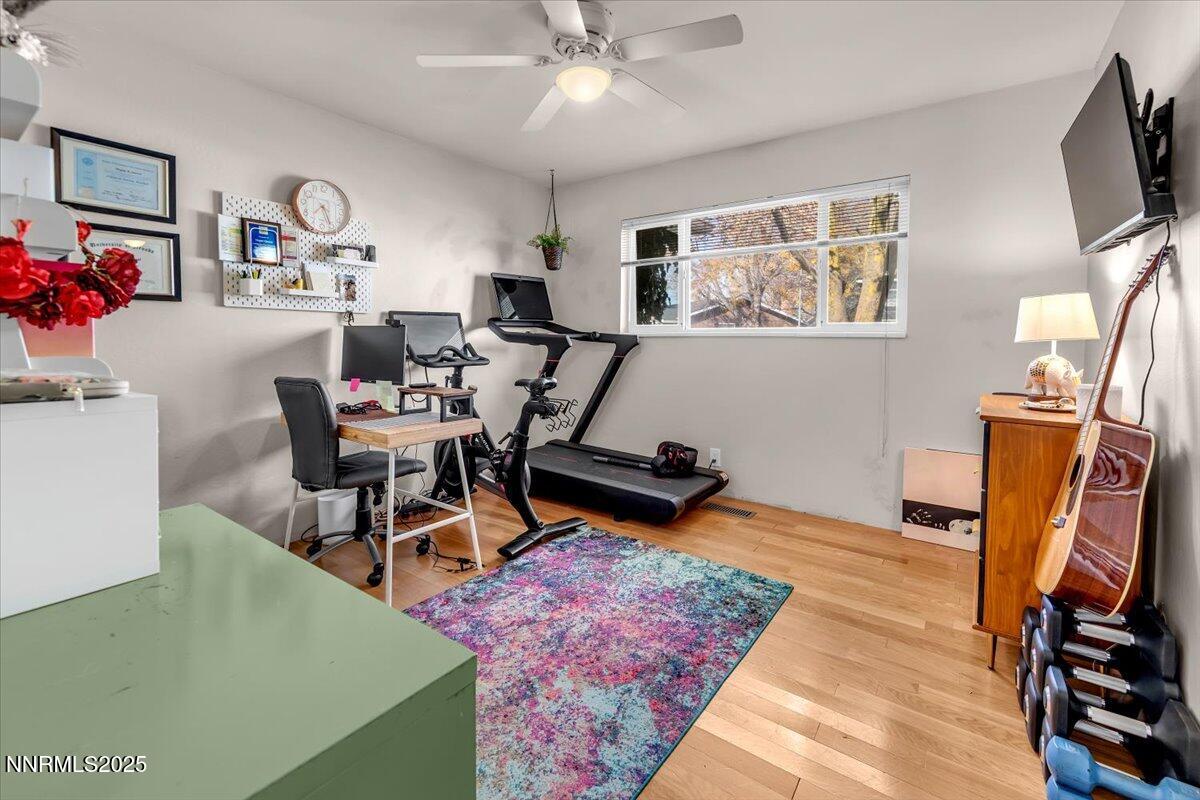 3880 Piccadilly Drive Reno, NV 89509 - Photo 35 of 58 a living room with furniture a flat screen tv and a window