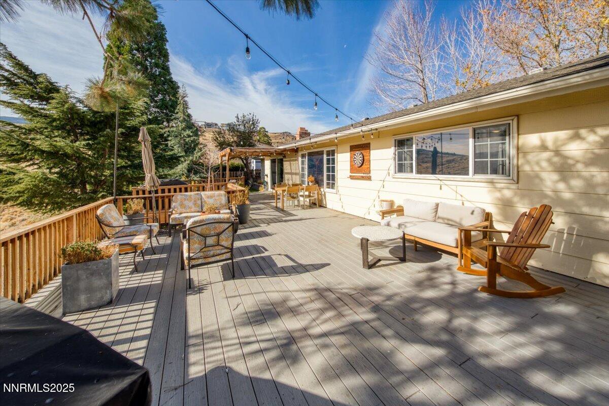 3880 Piccadilly Drive Reno, NV 89509 - Photo 42 of 58 a view of a patio with table and chairs and potted plants