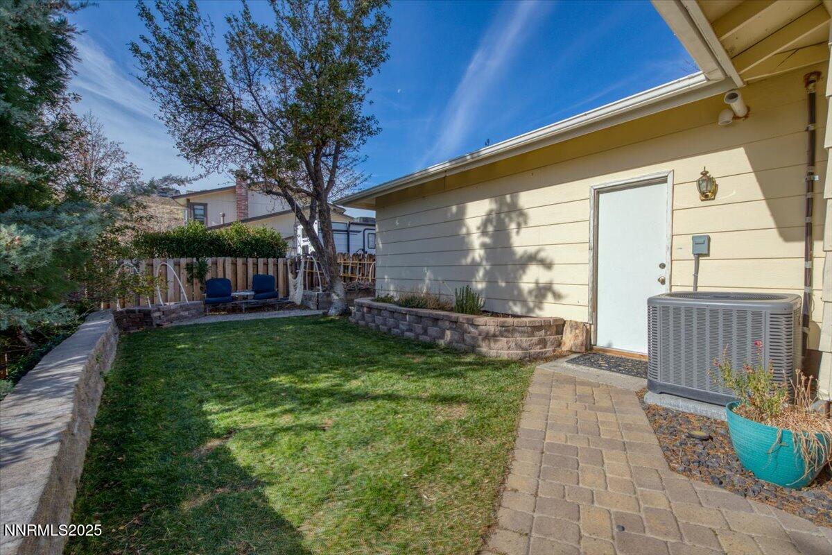 3880 Piccadilly Drive Reno, NV 89509 - Photo 46 of 58 a view of house with backyard and a garden