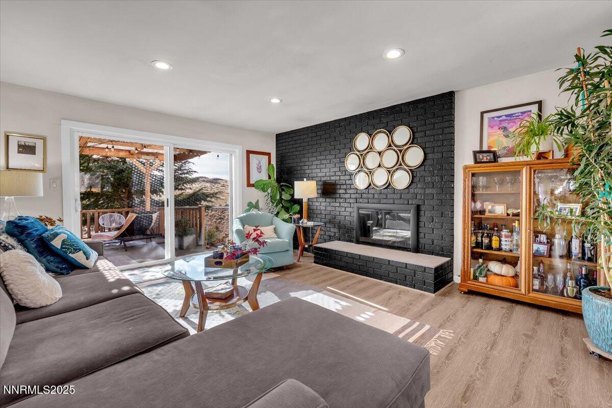3880 Piccadilly Drive Reno, NV 89509 - Photo 5 of 58 a living room with furniture a fireplace and a flat screen tv
