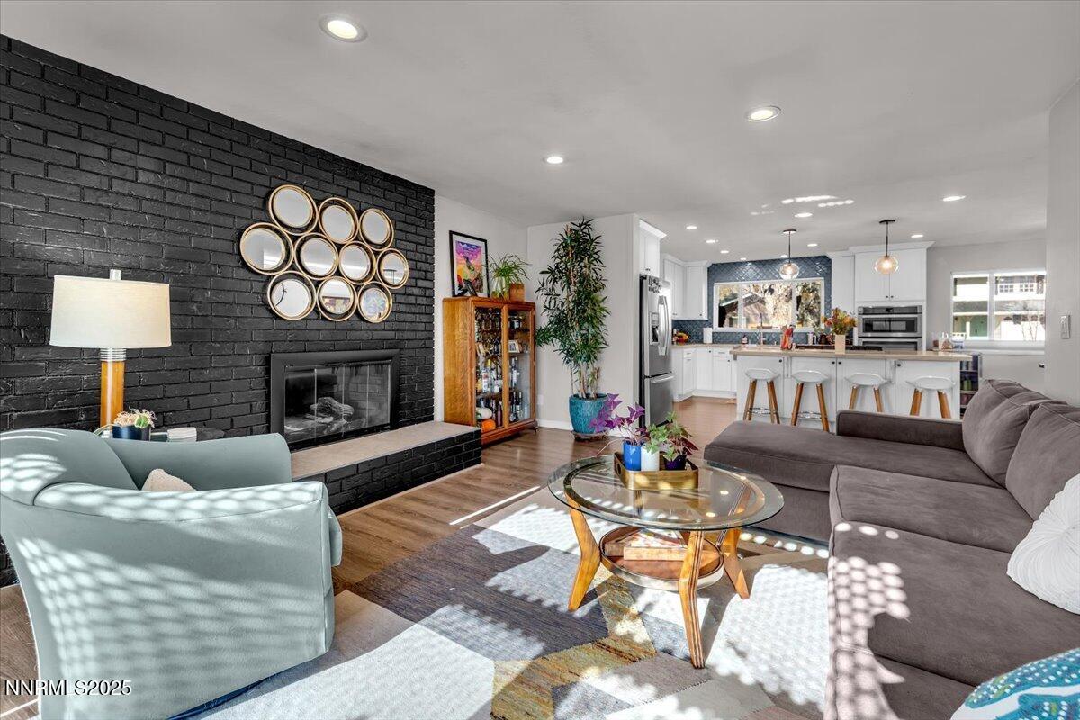 3880 Piccadilly Drive Reno, NV 89509 - Photo 6 of 58 a living room with furniture and a fireplace
