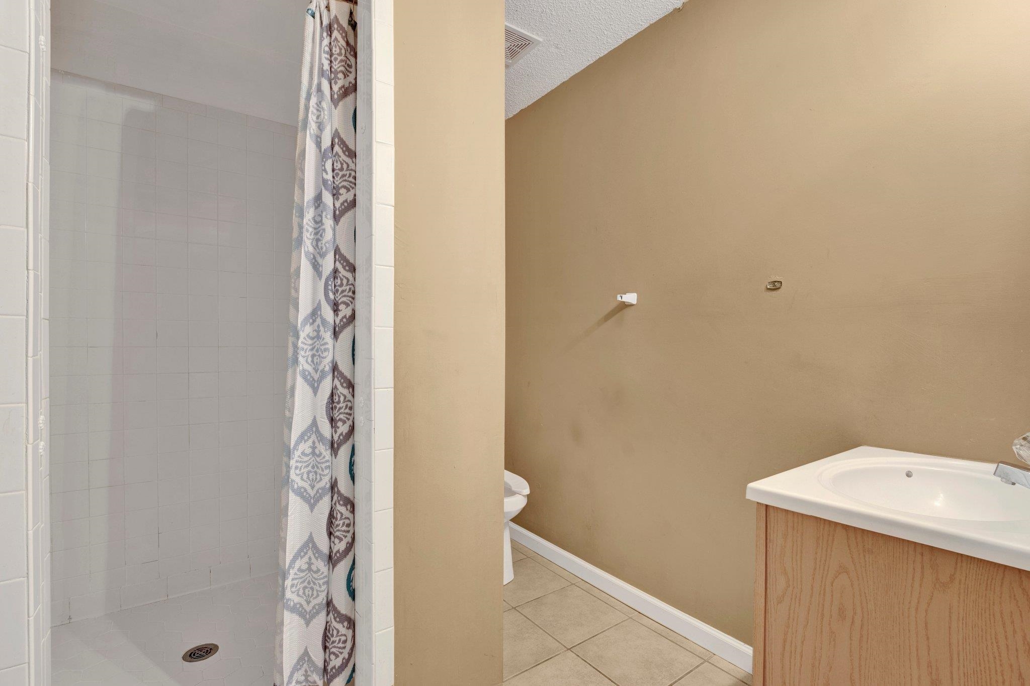 385 Boston Street Memphis, TN 38111 - Photo 11 of 11 a bathroom with a shower