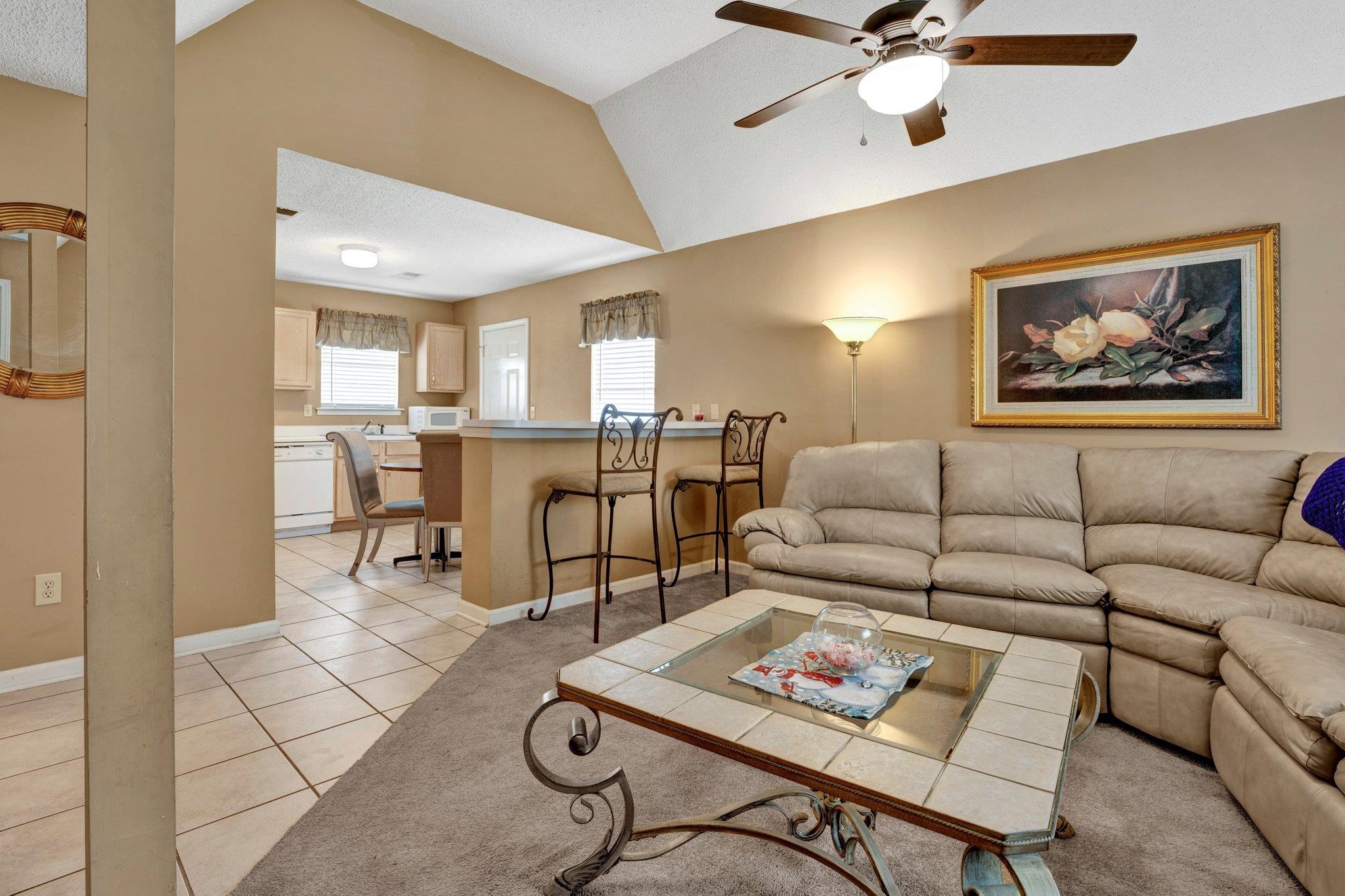 385 Boston Street Memphis, TN 38111 - Photo 2 of 11 a living room with furniture and kitchen view