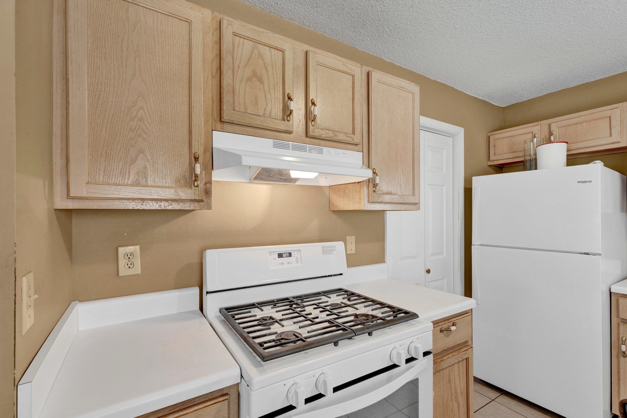 385 Boston Street Memphis, TN 38111 - Photo 6 of 11 a kitchen with white cabinets