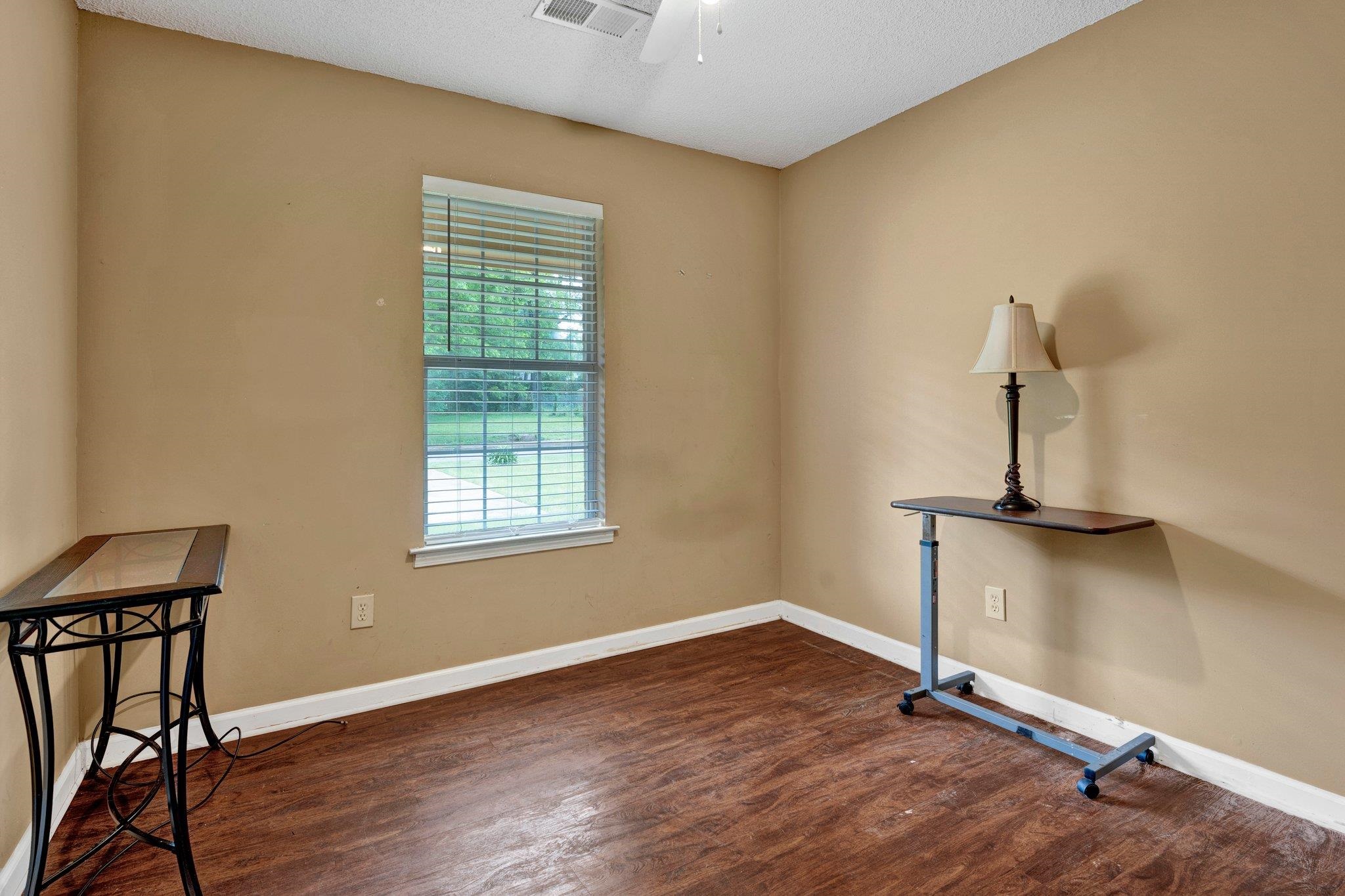 385 Boston Street Memphis, TN 38111 - Photo 8 of 11 a view of a room with wooden floor cabinet and a window