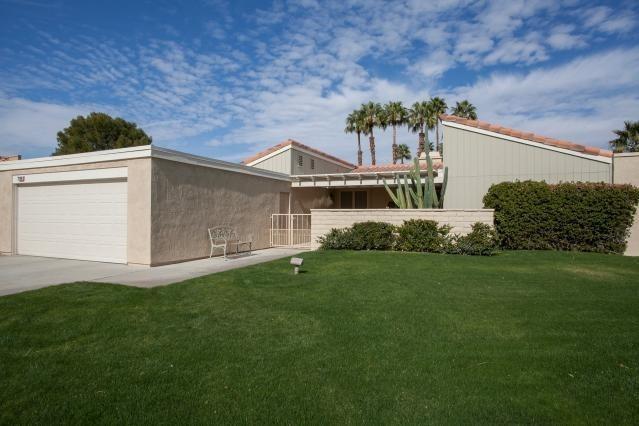 72300 Rodeo Way Rancho Mirage, CA 92270 - Photo 1 of 34 a front view of a house with a yard