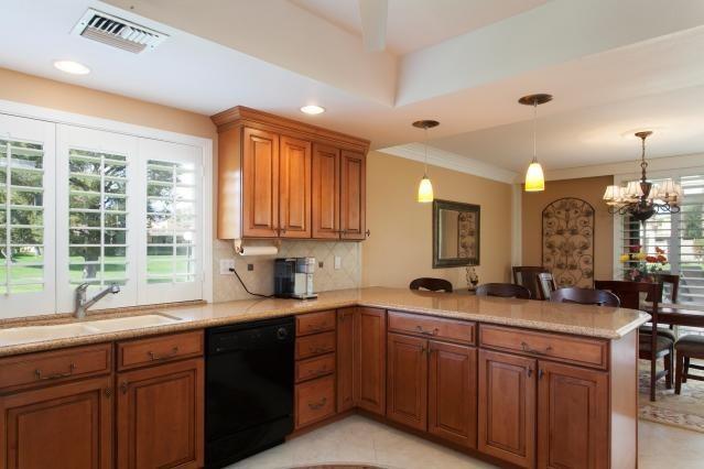 72300 Rodeo Way Rancho Mirage, CA 92270 - Photo 12 of 34 a kitchen with lots of counter top space sink and large window