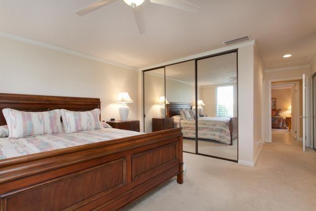 72300 Rodeo Way Rancho Mirage, CA 92270 - Photo 19 of 34 a spacious bedroom with a balcony a bed and a mirror