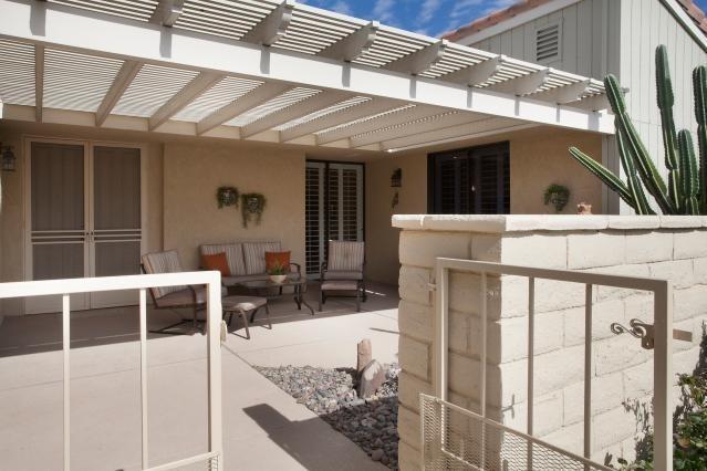 72300 Rodeo Way Rancho Mirage, CA 92270 - Photo 3 of 34 a balcony with table and chairs