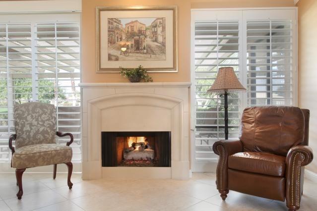 72300 Rodeo Way Rancho Mirage, CA 92270 - Photo 6 of 34 a living room with furniture a fireplace and a large window