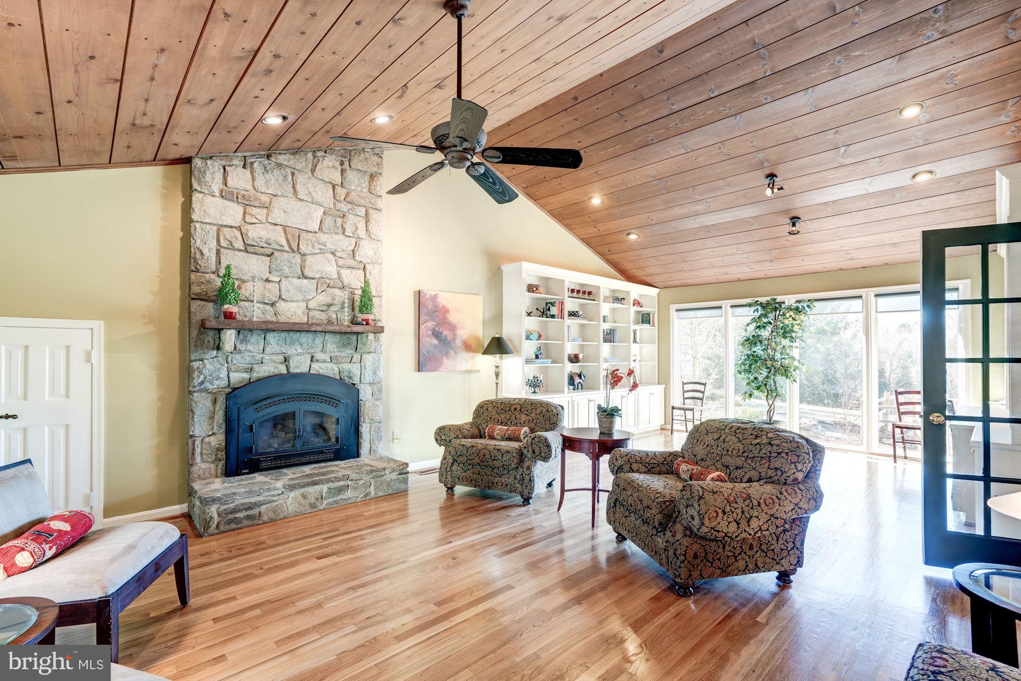 1124 Walker Road Great Falls, VA 22066 - Photo 11 of 30 Family room has stone fireplace converted to gas.