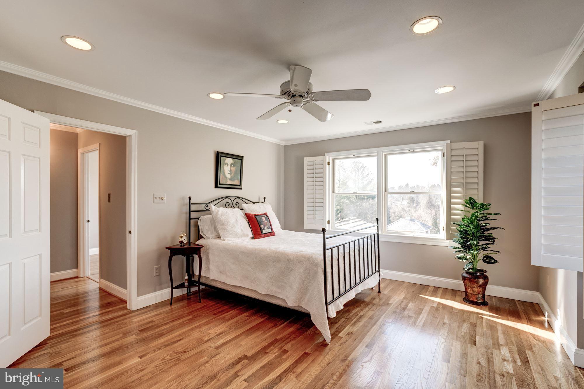 1124 Walker Road Great Falls, VA 22066 - Photo 15 of 30 Master bedroom with plantation shutters, fan.