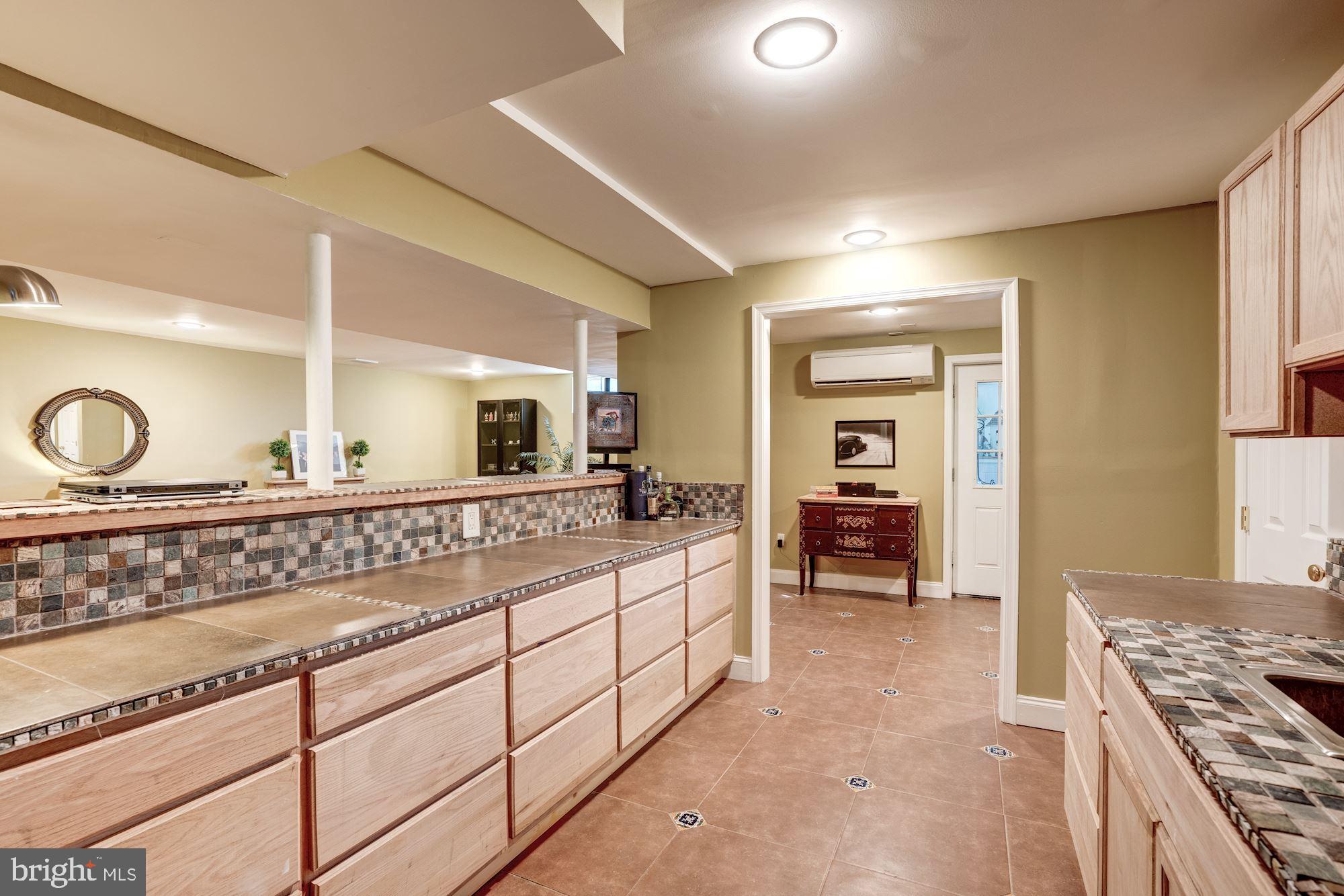 1124 Walker Road Great Falls, VA 22066 - Photo 22 of 30 Wet bar opens to receraetion room.