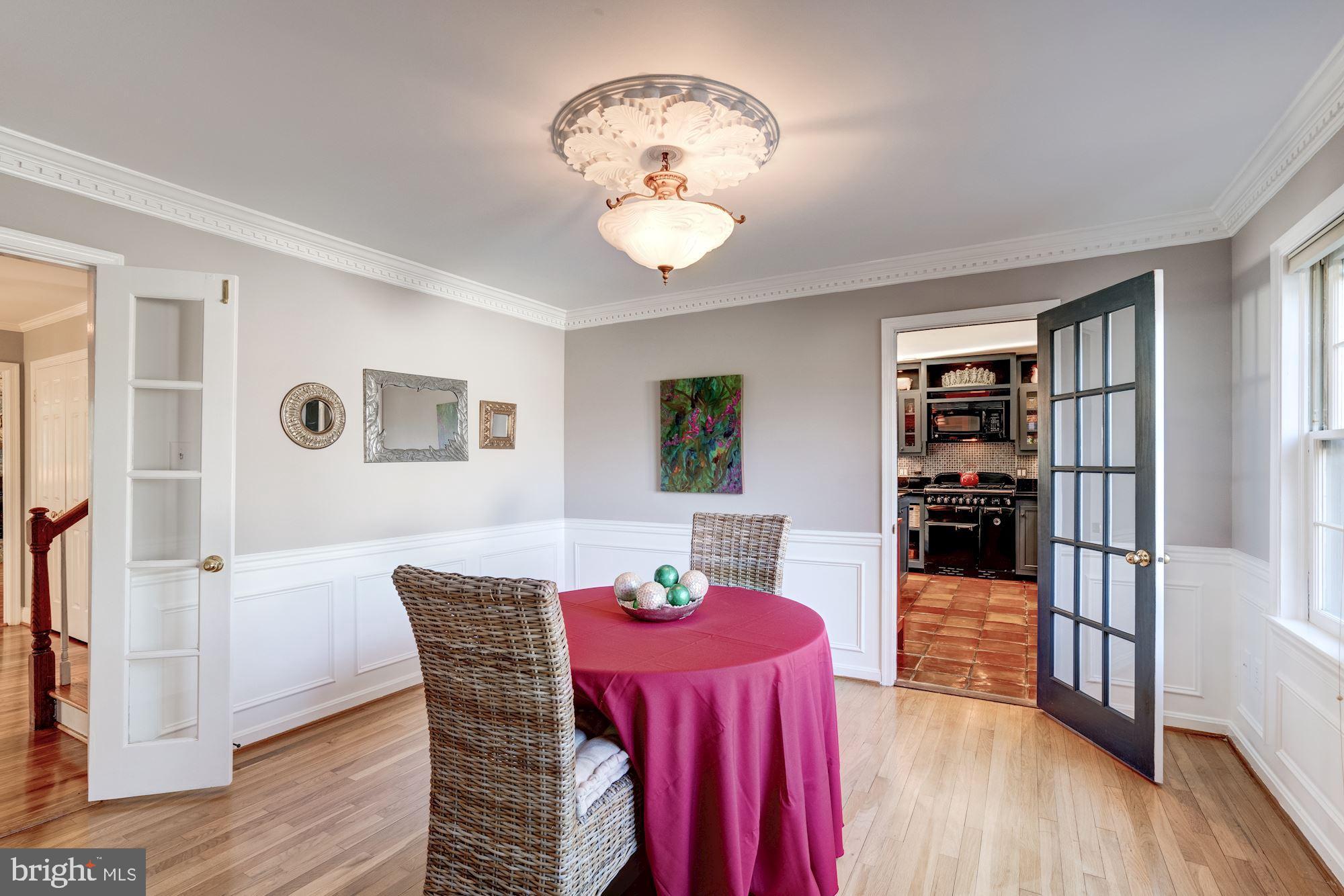 1124 Walker Road Great Falls, VA 22066 - Photo 6 of 30 Dining room with panel moldings, ceiling medallion