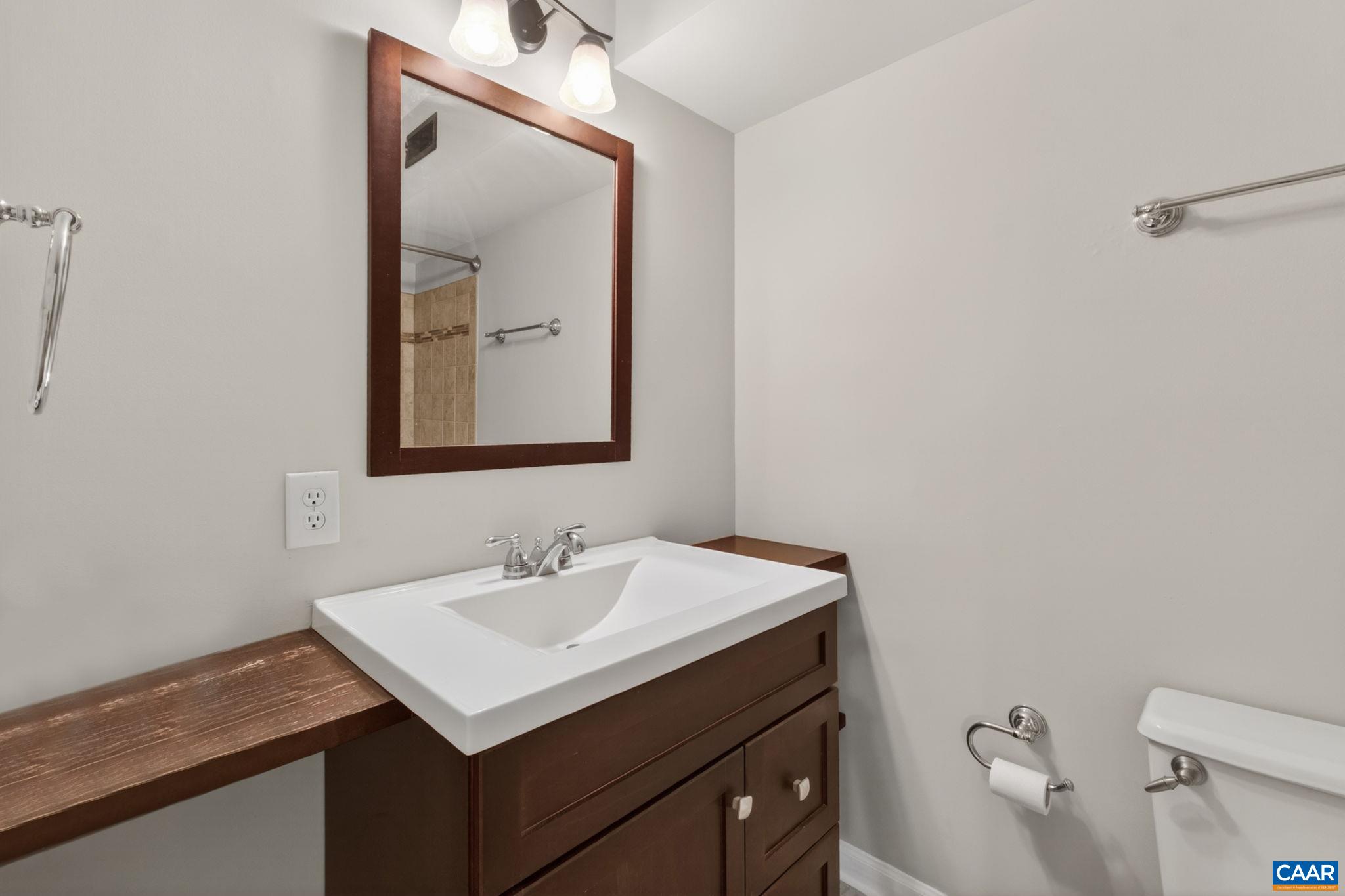 103 Turtle Creek Road, Unit 8 Charlottesville, VA 22901 - Photo 21 of 37 a bathroom with a sink vanity and a mirror