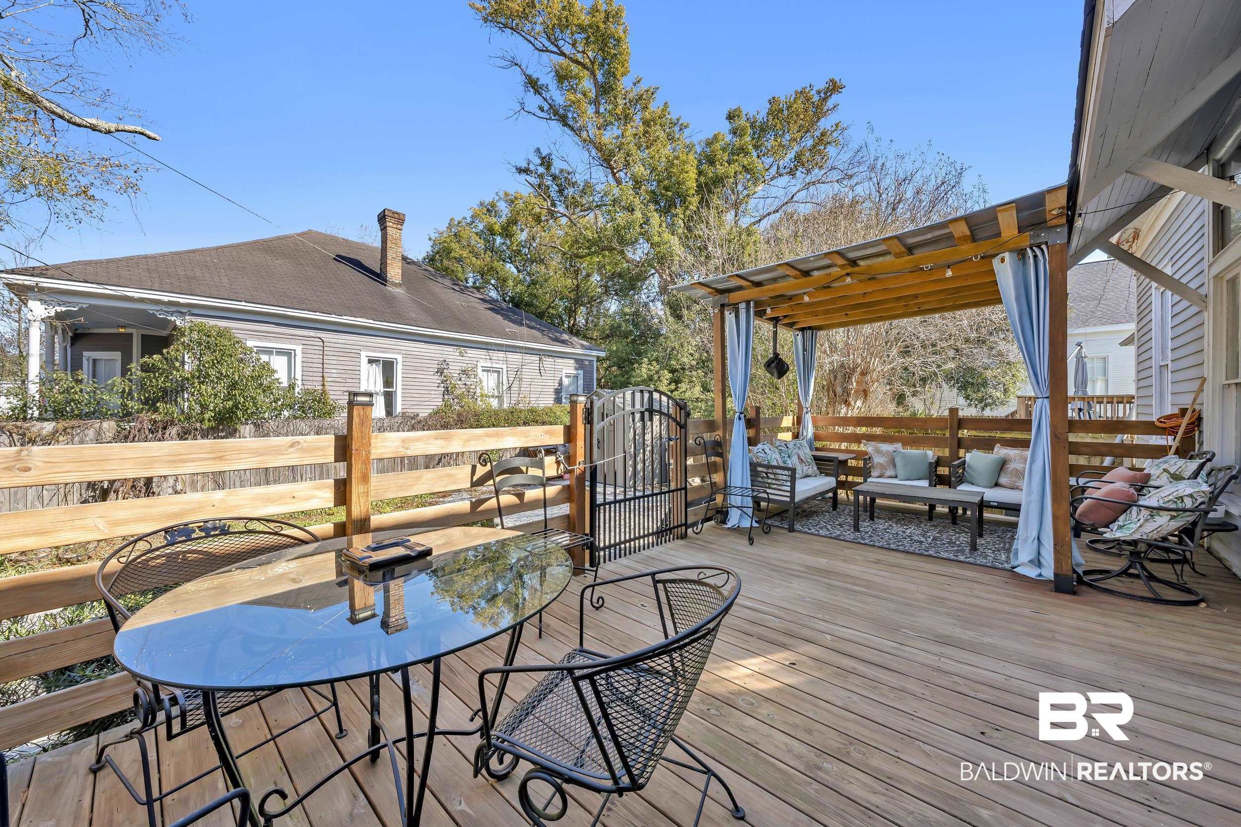 1322 Dauphin Street Mobile, AL 36604 - Photo 19 of 21 Wooden deck featuring outdoor lounge area