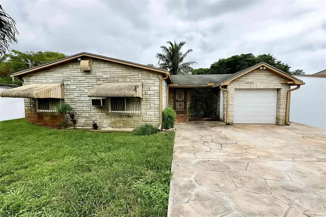 a front view of a house with garage