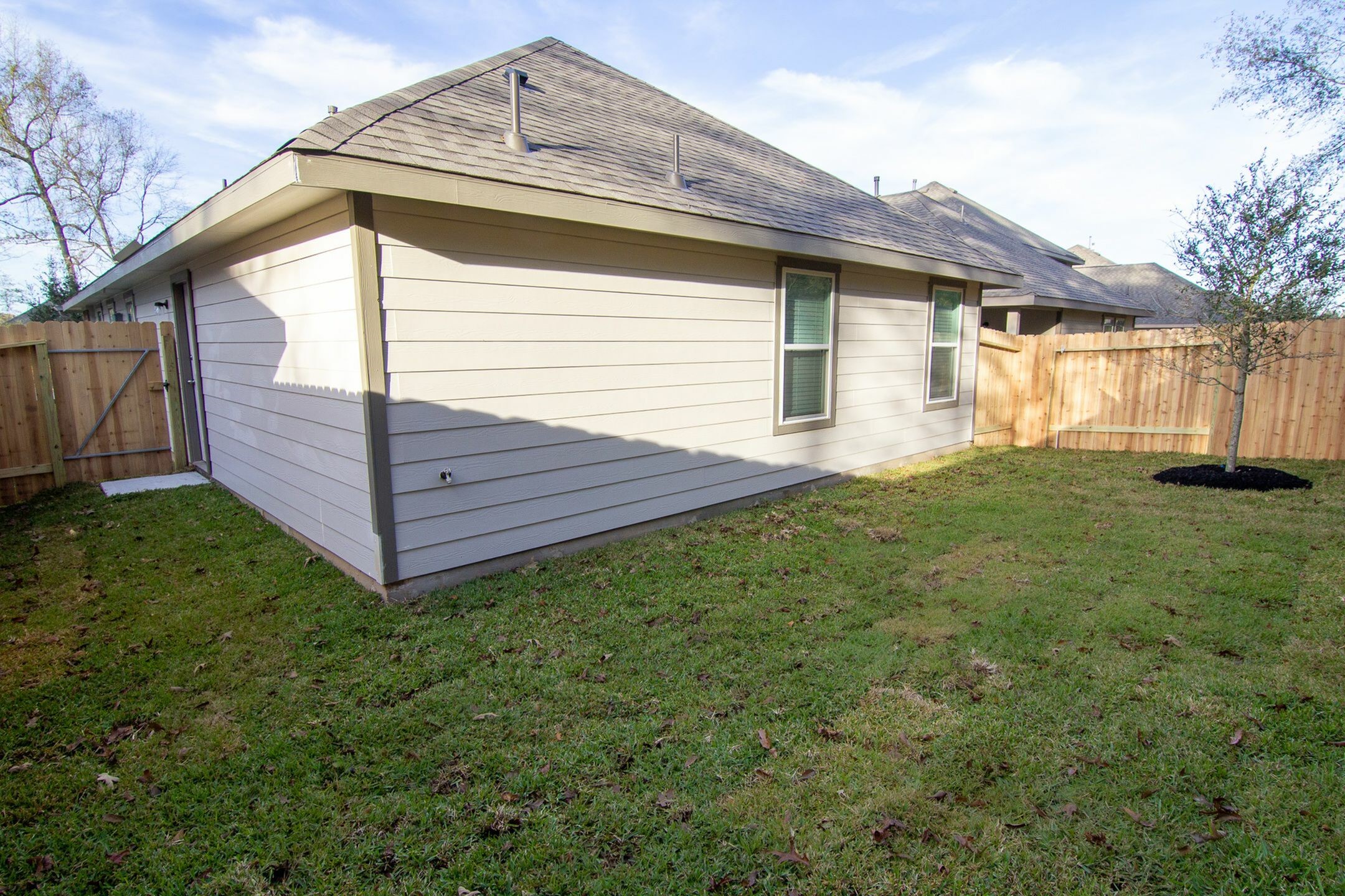 3512 Cub Court Conroe, TX 77301 - Photo 18 of 18 a view of a house with a yard