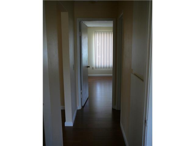 1452 Panorama Ridge Road Oceanside, CA 92056 - Photo 10 of 21 Hallway separating the two bedrooms, adds a sense of privacy.