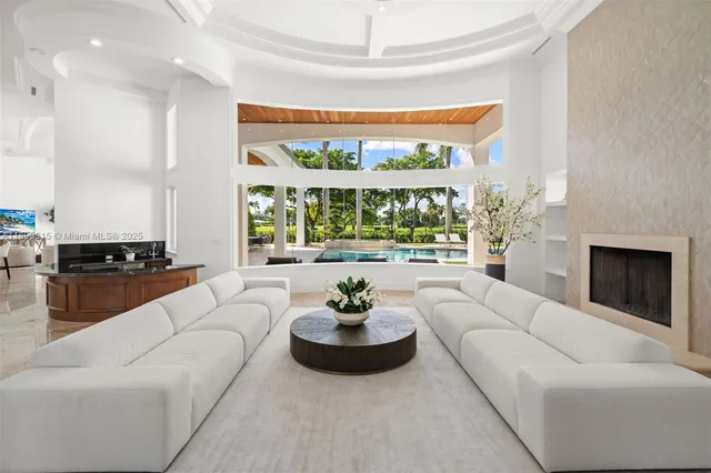 a kitchen with cabinets a sink counter and chairs