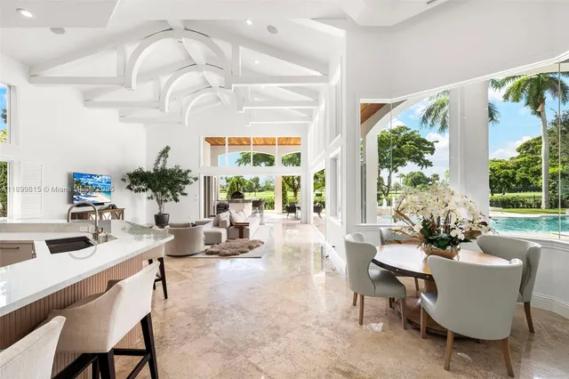 a living room with furniture a lamp and a potted plant