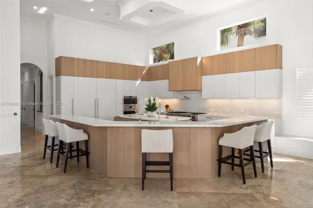 a view of a house with pool and sitting area