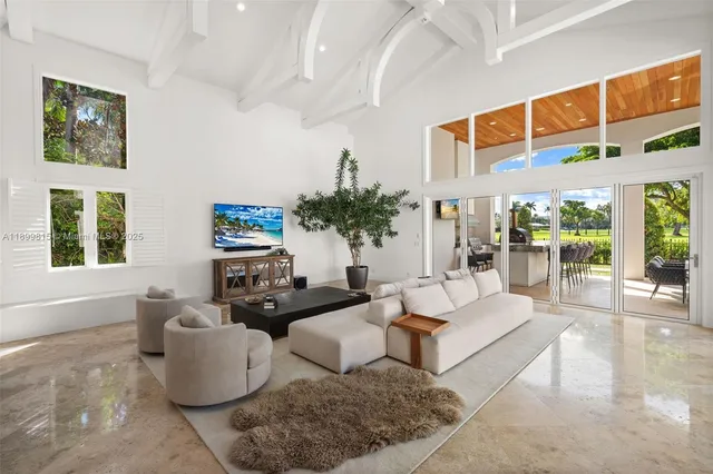 a kitchen with lots of counter top space and furniture