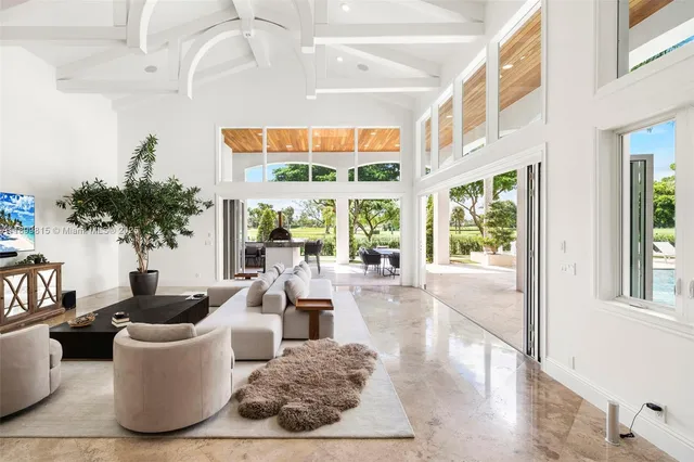 a bathroom with a white tub shower vanity and a sink