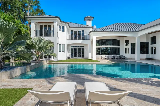 a spacious bathroom with a double vanity sink toilet and shower