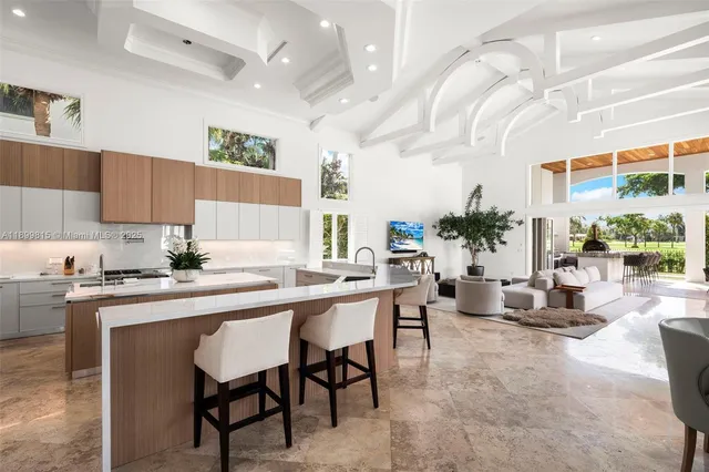 a bathroom with a granite countertop sink a toilet and a mirror