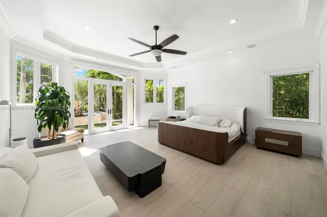 a front view of a house with a yard garden and outdoor seating