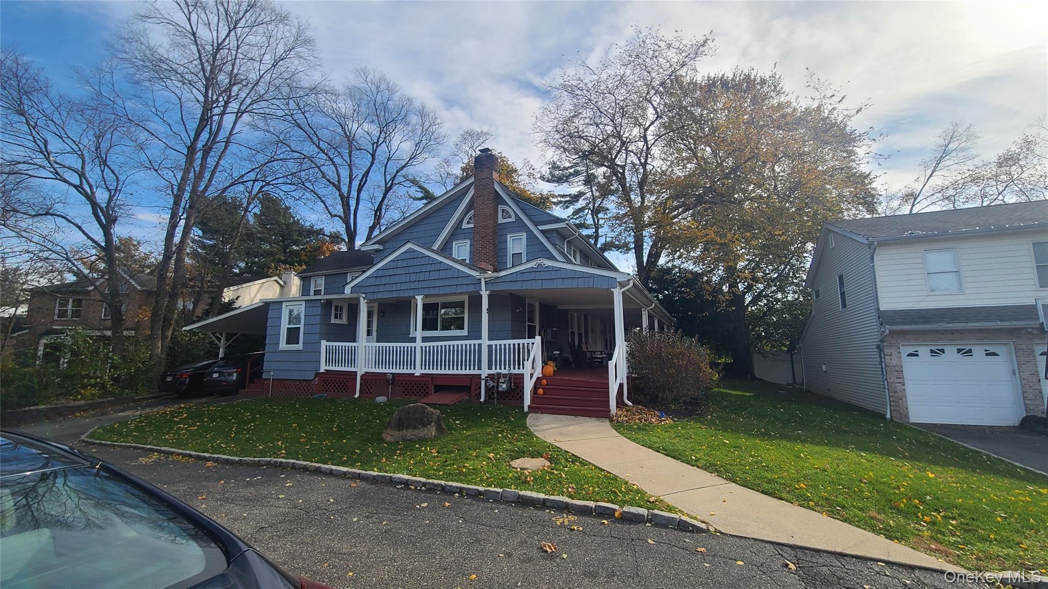 2 Addison Lane Greenvale, NY 11548 - Photo 3 of 18 a front view of a house with a yard