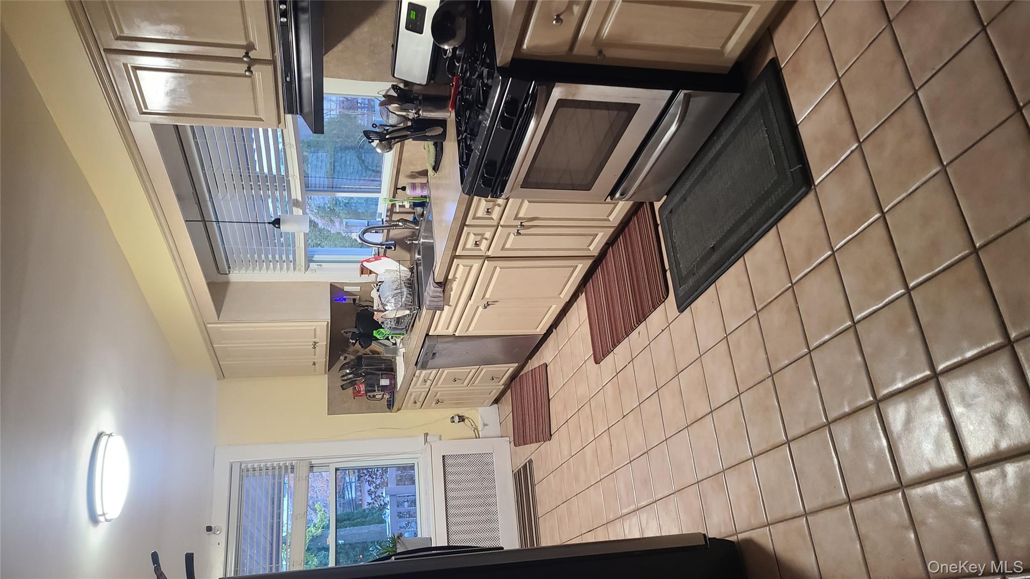 2 Addison Lane Greenvale, NY 11548 - Photo 7 of 18 a kitchen with stainless steel appliances granite countertop a stove a sink and a microwave
