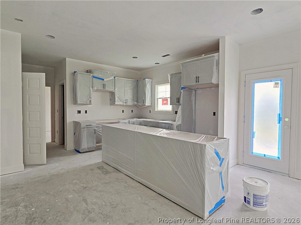 2650 Norrington Road Lillington, NC 27546 - Photo 8 of 24 a kitchen with a sink cabinets stainless steel appliances and a window