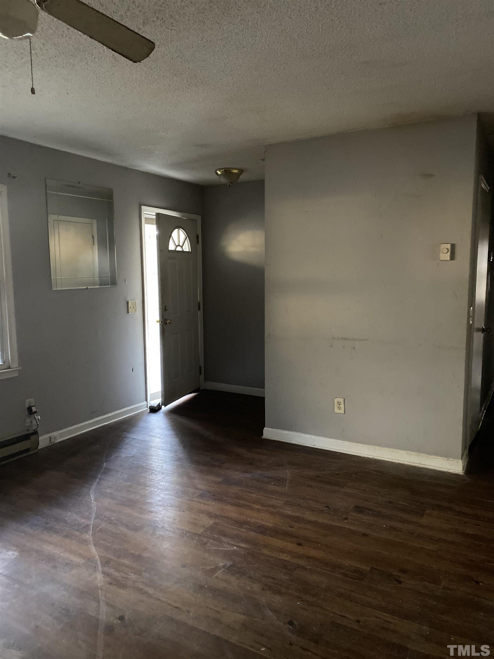 2428 Keith Drive Raleigh, NC 27610 - Photo 9 of 24 a view of an empty room with wooden floor
