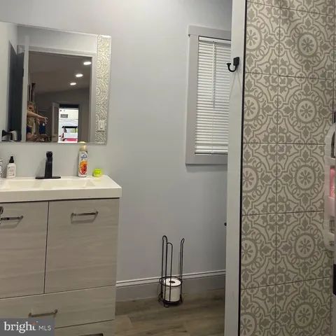 a bathroom with a sink and mirror