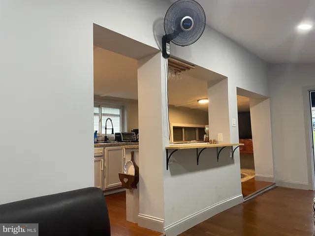 a view of living room with furniture and a window