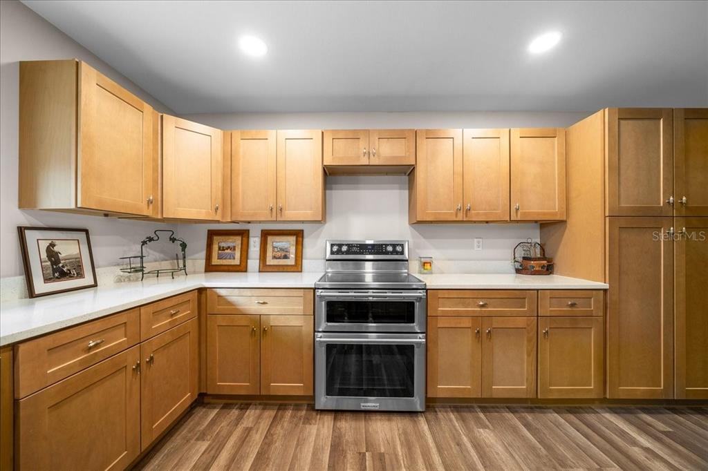 7380 Southwest 86th Lane Ocala, FL 34476 - Photo 12 of 50 a kitchen with a stove a sink and a microwave