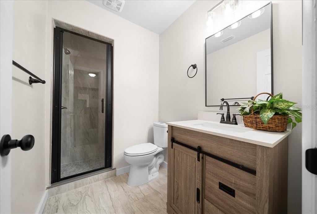 7380 Southwest 86th Lane Ocala, FL 34476 - Photo 17 of 56 a bathroom with a sink toilet and shower