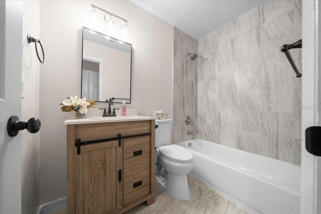 7380 Southwest 86th Lane Ocala, FL 34476 - Photo 19 of 50 a bathroom with a sink toilet and shower