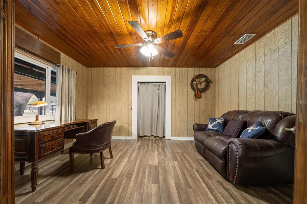 7380 Southwest 86th Lane Ocala, FL 34476 - Photo 22 of 50 a living room with furniture and a wooden floor