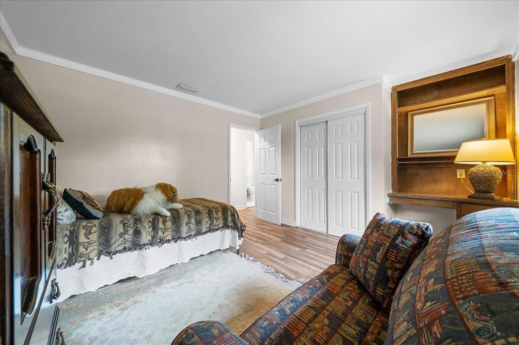 7380 Southwest 86th Lane Ocala, FL 34476 - Photo 22 of 56 a bedroom with a bed and window