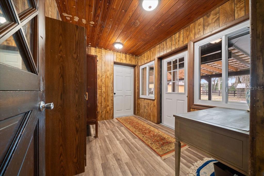 7380 Southwest 86th Lane Ocala, FL 34476 - Photo 24 of 56 a view of a hallway with wooden floor and staircase
