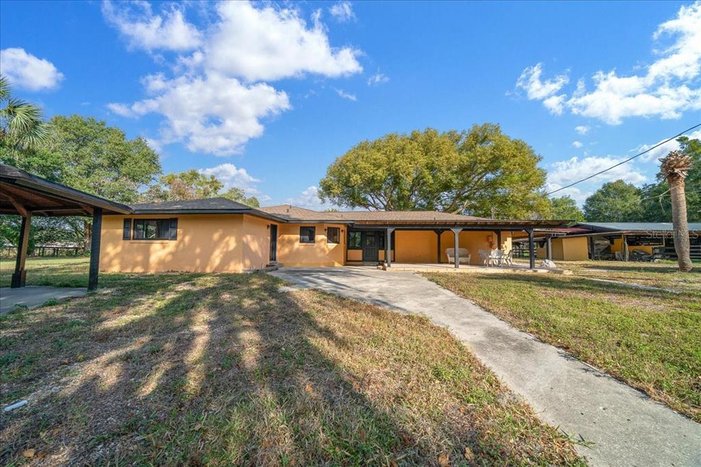 7380 Southwest 86th Lane Ocala, FL 34476 - Photo 28 of 50 a front view of a house with a yard