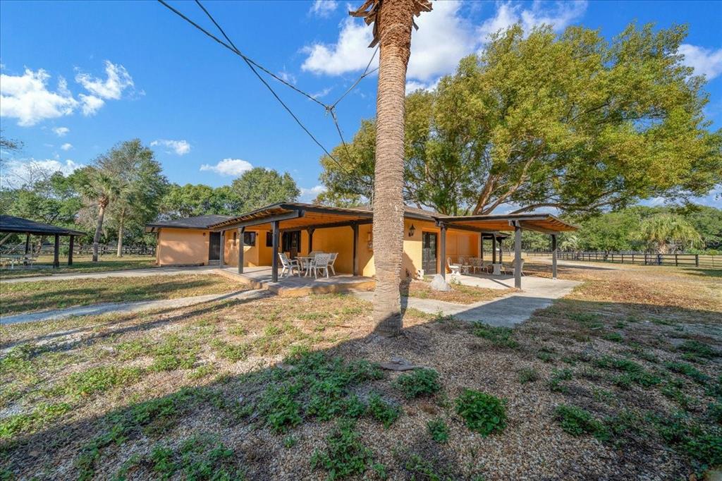 7380 Southwest 86th Lane Ocala, FL 34476 - Photo 28 of 56 a view of a house with a yard