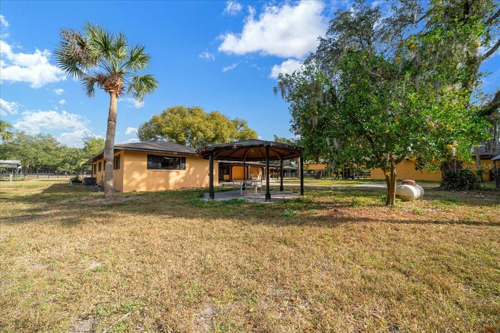 7380 Southwest 86th Lane Ocala, FL 34476 - Photo 30 of 56 a front view of a house with a yard
