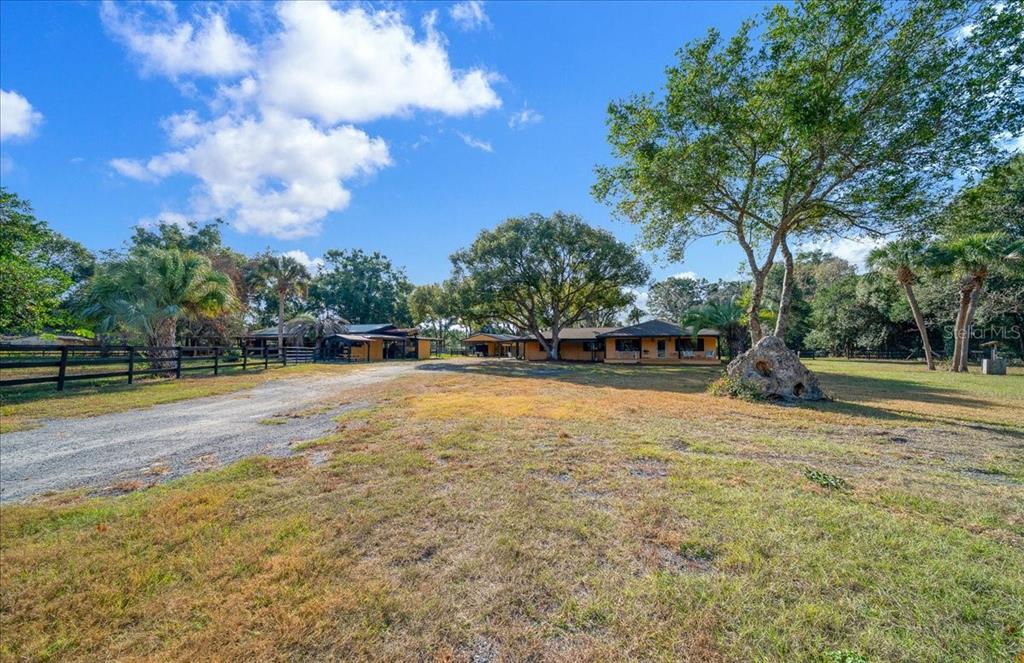 7380 Southwest 86th Lane Ocala, FL 34476 - Photo 3 of 56 a view of a swimming pool with a yard