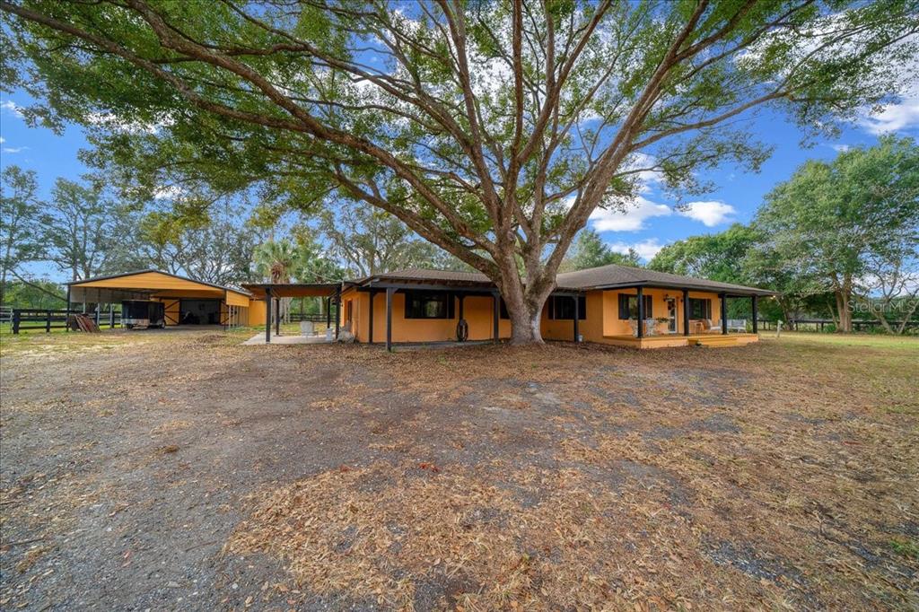 7380 Southwest 86th Lane Ocala, FL 34476 - Photo 3 of 50 a front view of a house with parking space