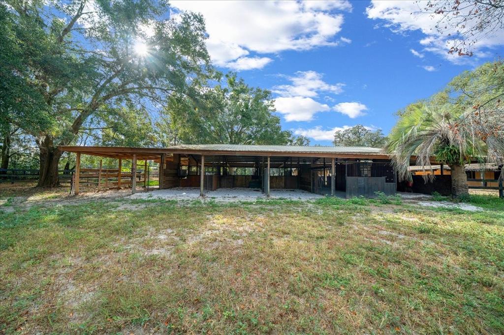 7380 Southwest 86th Lane Ocala, FL 34476 - Photo 36 of 50 a front view of a house with a garden