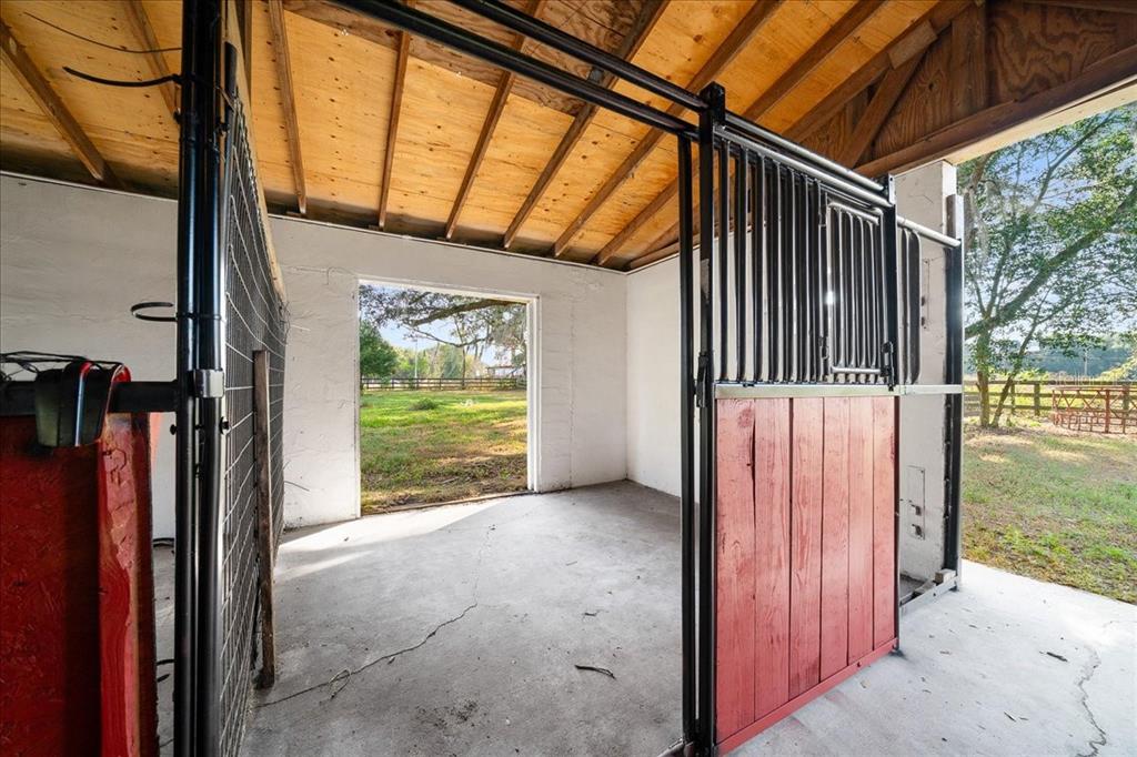 7380 Southwest 86th Lane Ocala, FL 34476 - Photo 38 of 50 a view of a porch with a door and wooden floor